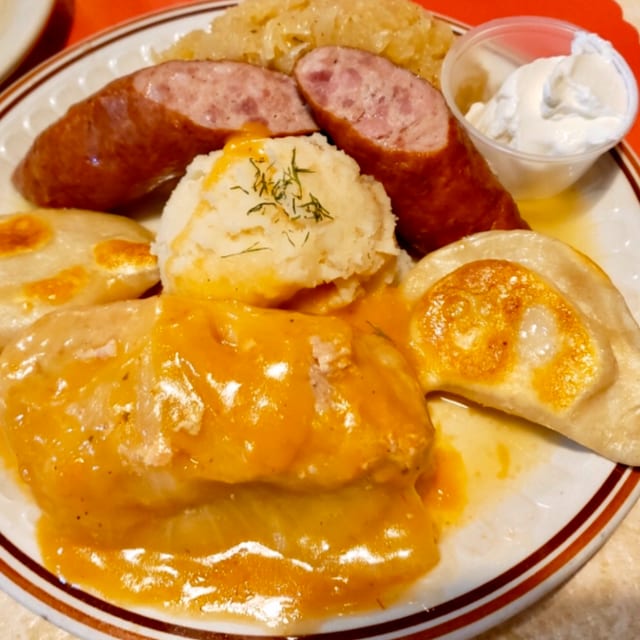Homemade Stuffed Cabbage with Kielbasa, Pierogi, Kraut & Dill Potato.