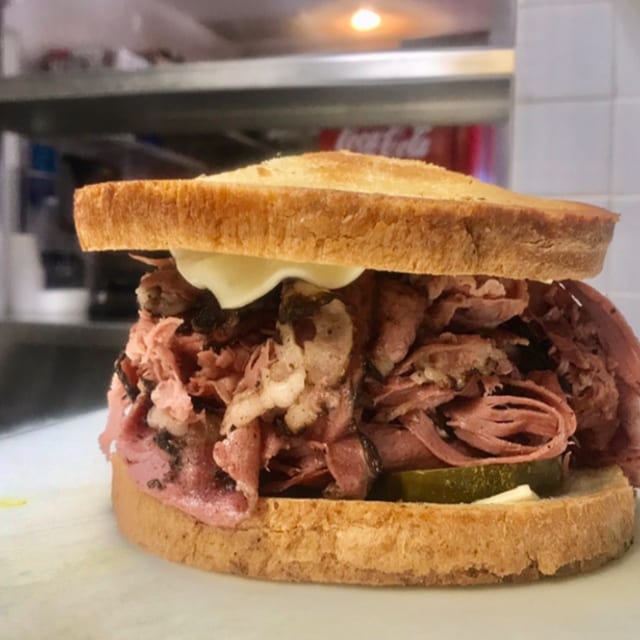 Sy Ginsberg Brand Corned Beef or Pastrami Sandwich on Rye, Onion Roll or Kaiser Roll.